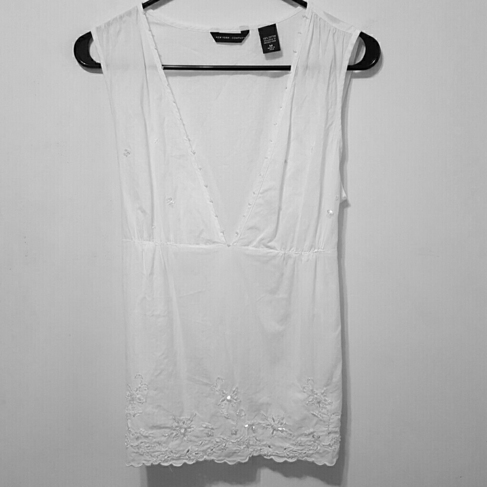 Sleeveless white blouse